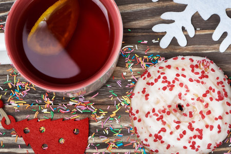 Christmas treats and decorations on the wooden backgroundの写真素材