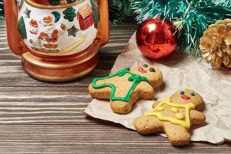 Christmas ornament and cookies on wooden background