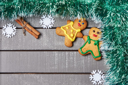Christmas ornament and cookies on wooden background