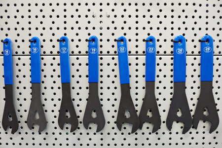 Tool kit for bicycle repair on wall of workshopの写真素材