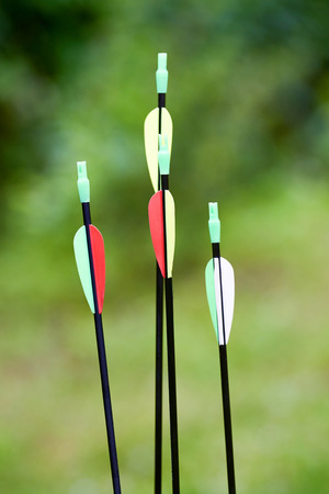 Little archer with bow and arrows outdoorsの写真素材