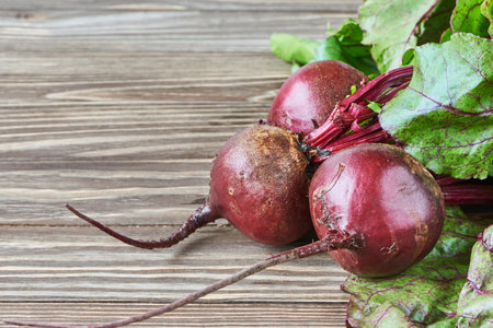Fresh beet bunch on wooden background