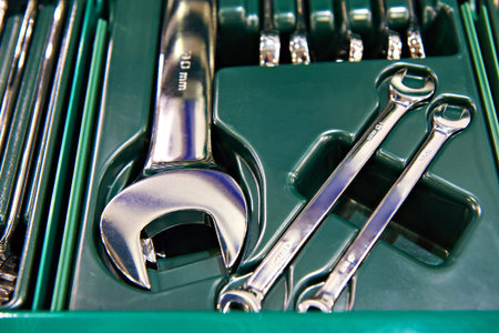 Open-end wrenches in plastic box closeup