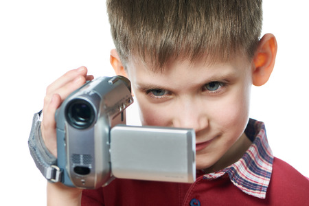 Little boy with a video camera isolated whiteの写真素材