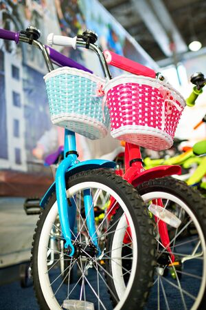 Two children's bike blue and pink for boys and girlsの写真素材