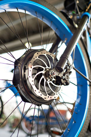 Front wheel electric bike with engine and brake disk closeupの写真素材