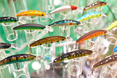 Different colorful plastic fishing baits in storeの写真素材