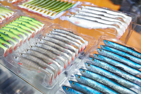 Soft plastic fishing baits in boxes on store