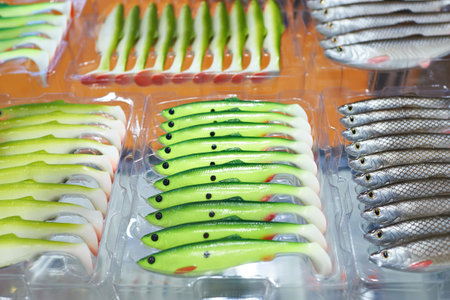Soft plastic fishing baits in boxes on store