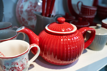 Red porcelain teapot in the sideboardの写真素材