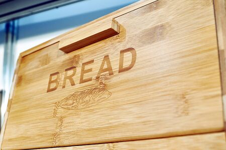 Wooden box for bread with textの写真素材