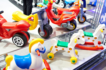Plastic horses and bicycles in a toy storeの写真素材
