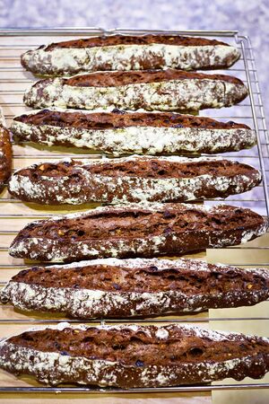 Fresh baguette rye bread in bakery closeupの写真素材