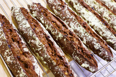 Fresh baguette rye bread in bakery closeupの写真素材