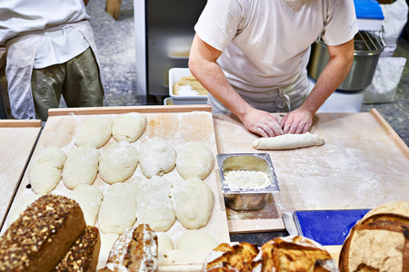 Dough loaf making in a bakeryの写真素材