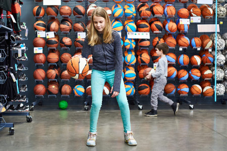 Children with basketballs in the sports shopの写真素材