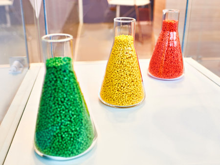 Plastic granular polymer. Samples in flasks