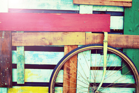 Decorative retro colored wooden cart with a wheelの写真素材