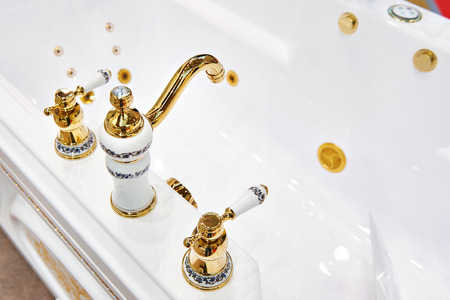 Bathtub and luxury faucet closeupの写真素材