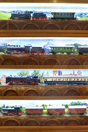 Train toy railway on a shop window closeupの写真素材