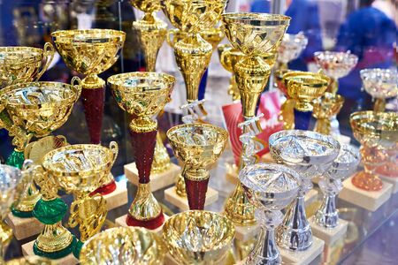 Award gold cups in the display caseの写真素材