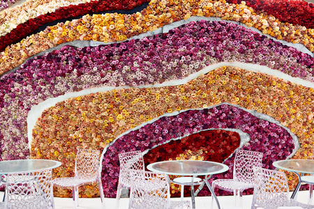 Background of flowers of roses in cafe with tablesのeditorial素材