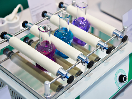 Linear shaker in chemical laboratory with samplesの写真素材