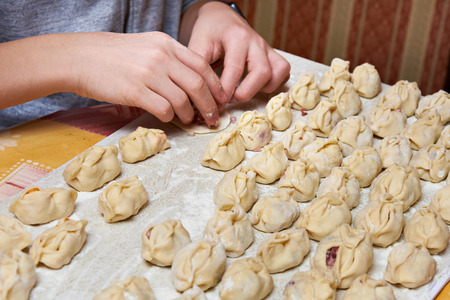 Making homemade ravioli with minced meatの写真素材