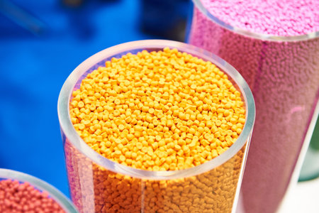 Plastic granular polymer. Samples in flasks