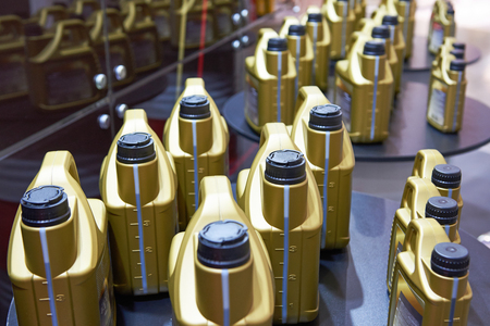 Plastic cans with motor oil in storeの写真素材