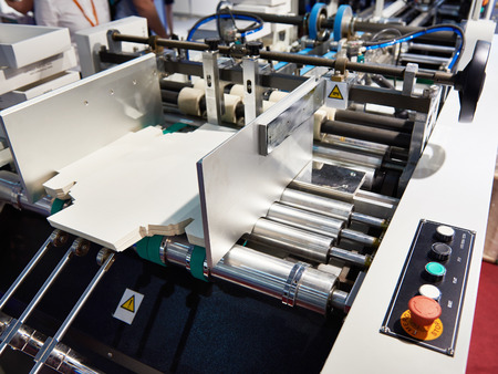 Machine for the production of cardboard packaging boxesの写真素材