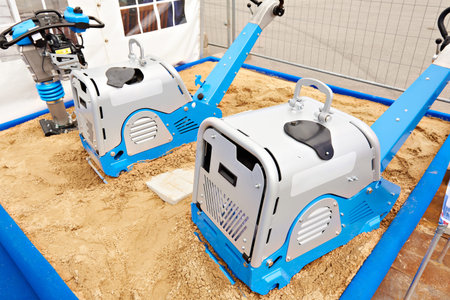 Diesel reversible plate compactors on sand in exhibition