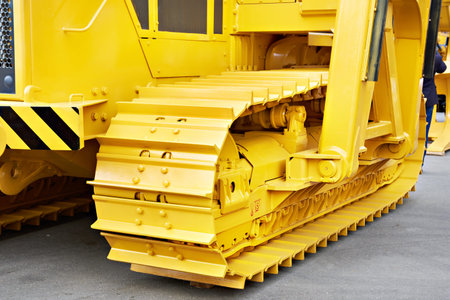 Yellow bulldozer in modern exhibition