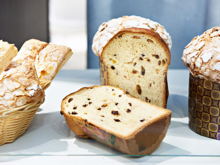 Oven and loaves of bread on a shelf in a bakery