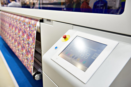 Bobbins with colored thread for industrial textile machines