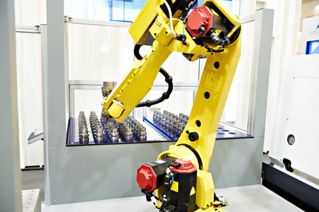 Robotic arm and workpieces for metalwork machineの写真素材