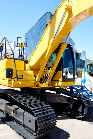 Buckets construction excavator on sky
