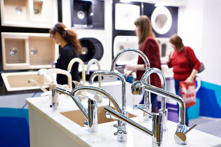 Customers at a store of faucets, sinks and kitchen appliancesの写真素材