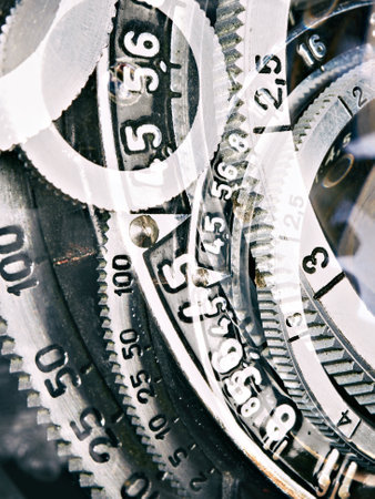 Aperture, shutter speed and focus ring on an old folding cameraの写真素材