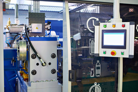 Semi-automatic blow molding machine for the production of plastic bottles