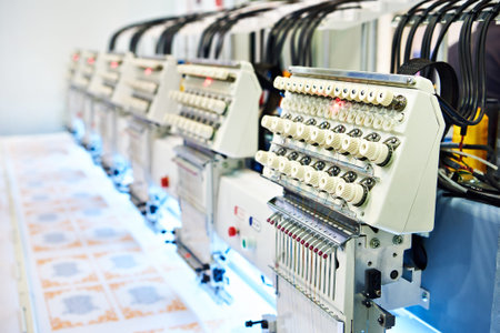 Embroidery industrial machine in sewing workshop