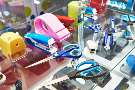 Stationery scissors, staplers and pencil sharpener in a shop window