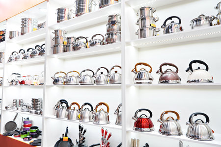 Metal stainless steel pots and teapots in the storeの写真素材