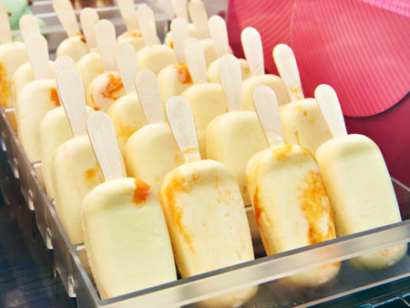 Ice cream on a stick in a tray in a storeの写真素材