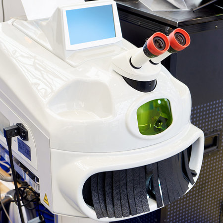 Modern laser welding machine with monitor and microscope