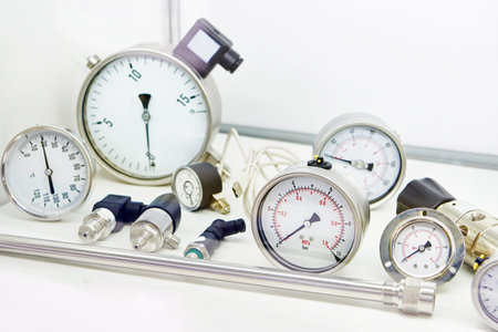 Industrial installation with pipes with watertight manometers and valves into water