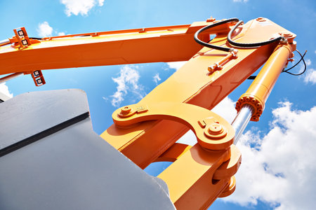 Excavator bucket hydraulics on sky backgroundの写真素材