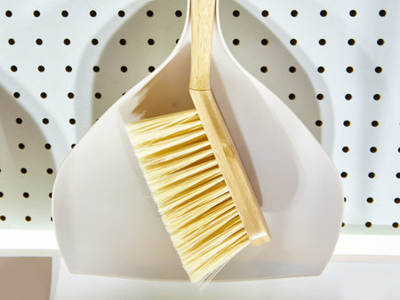 Household brushes with wooden handles in the store
