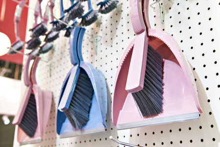Plastic brushes and scoops for cleaning in the shopの写真素材