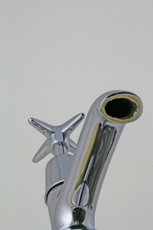 Plumbing â A view looking up at a tapの写真素材
